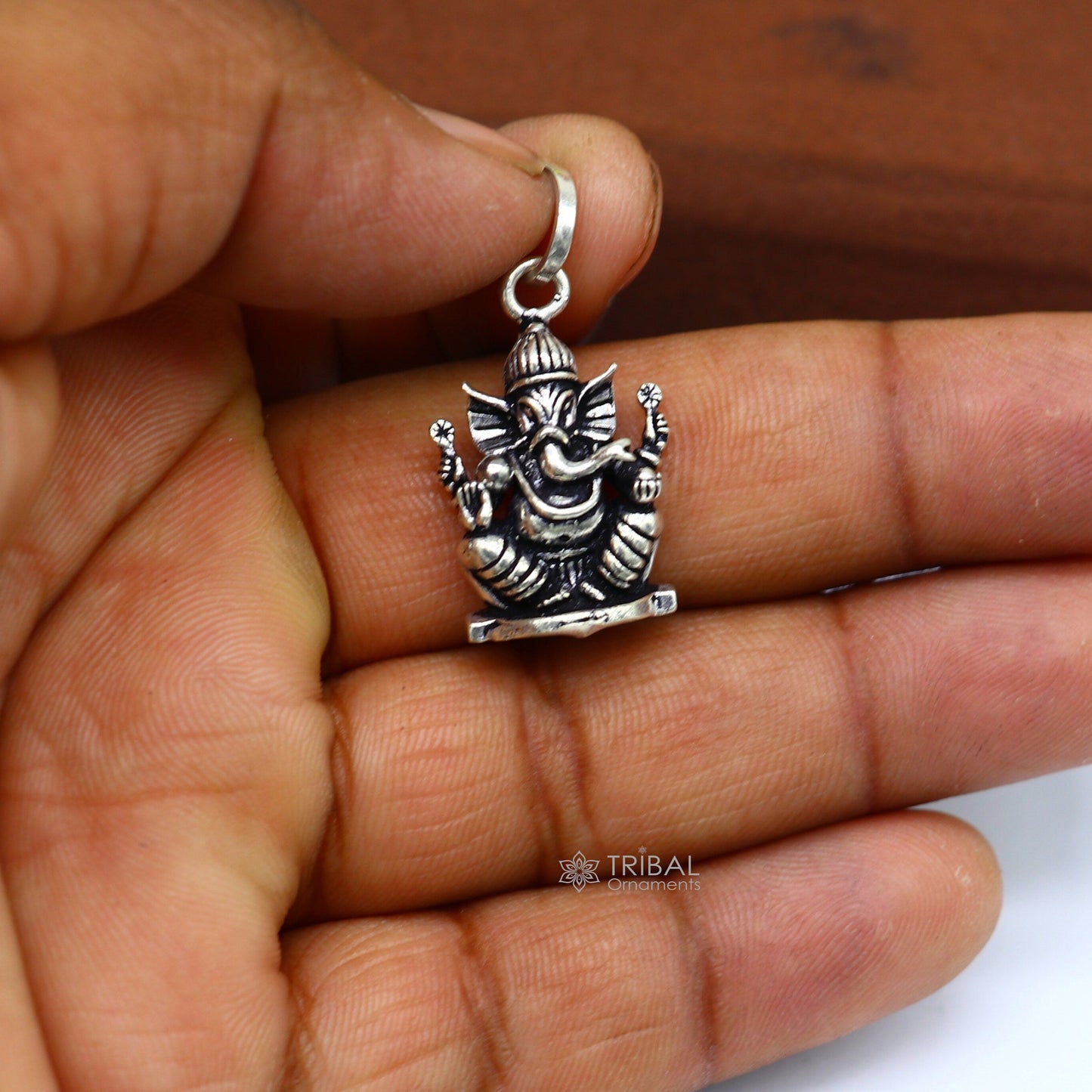 Handmade 925 sterling silver Lord Ganesha pendant, unisex tribal jewelry with personalized design and intricate tribal ornament details.