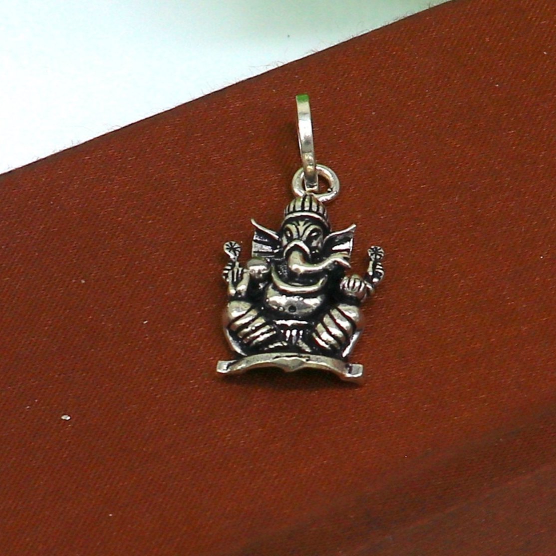 Sterling silver Lord Ganesha pendant by TRIBAL ORNAMENTS, unisex handmade jewelry with intricate tribal design and personalized style.