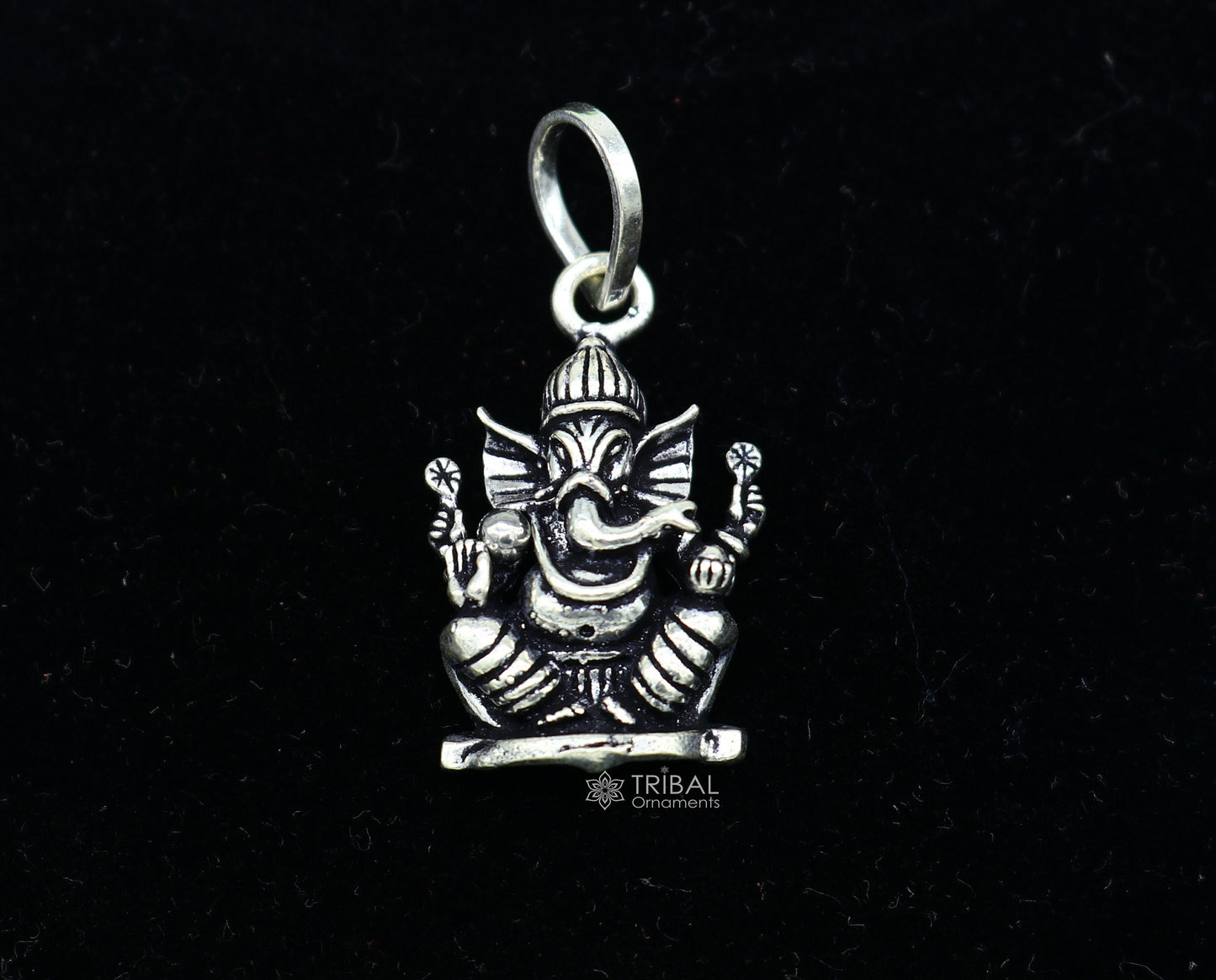 Sterling silver Lord Ganesha pendant by Tribal Ornaments, handmade unisex jewelry with intricate tribal design.