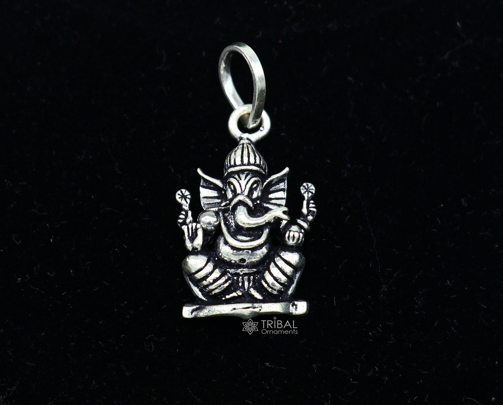 Sterling silver Lord Ganesha pendant by Tribal Ornaments, handmade unisex jewelry with intricate tribal design.