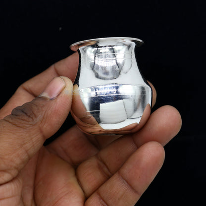 Small handmade pure 925 sterling silver Kalash pot for puja, featuring a plain design, ideal for water or milk offerings in India.