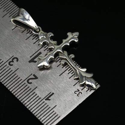 Sterling silver cross pendant by TRIBAL ORNAMENTS, vintage-style unisex jewelry with an intricate, stylish design.