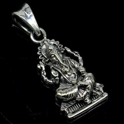 Sterling silver Ganesha pendant featuring intricate Hindu goddess design, crafted by TRIBAL ORNAMENTS for elegant jewelry.