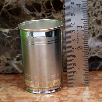 Handmade pure 999 silver water and milk glass tumbler, silver flask, and baby silver utensils by TRIBAL ORNAMENTS.