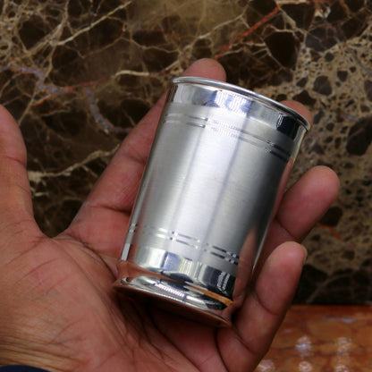 Handmade Pure 999 fine silver water and milk glass tumbler, silver flask, and kids silver utensils by Tribal Ornaments.