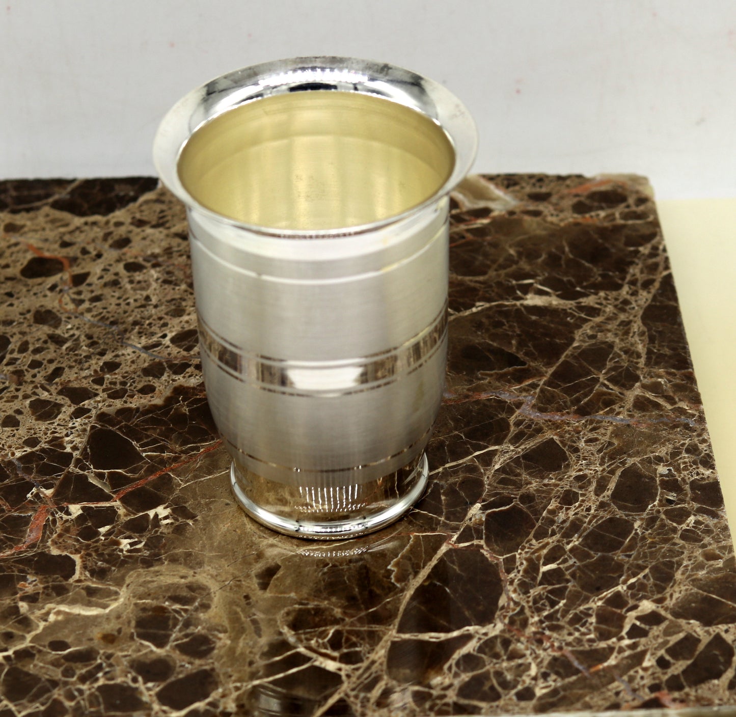 Pure 999 fine silver handmade tumbler and flask, silver water and milk glasses, and baby silver utensils by TRIBAL ORNAMENTS.