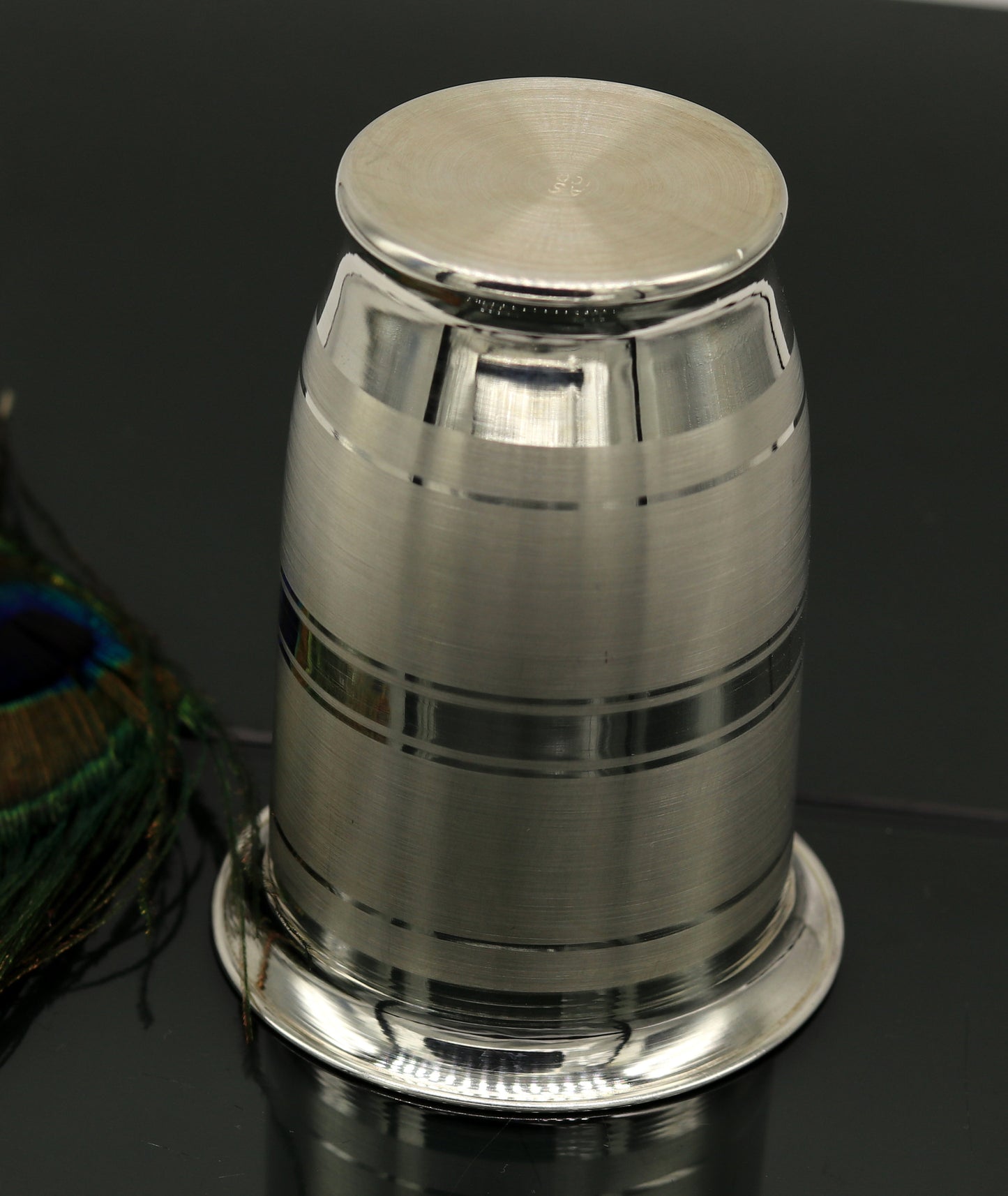 Handmade pure 999 silver water and milk glass tumbler, silver flask, and baby silver utensils by Tribal Ornaments.
