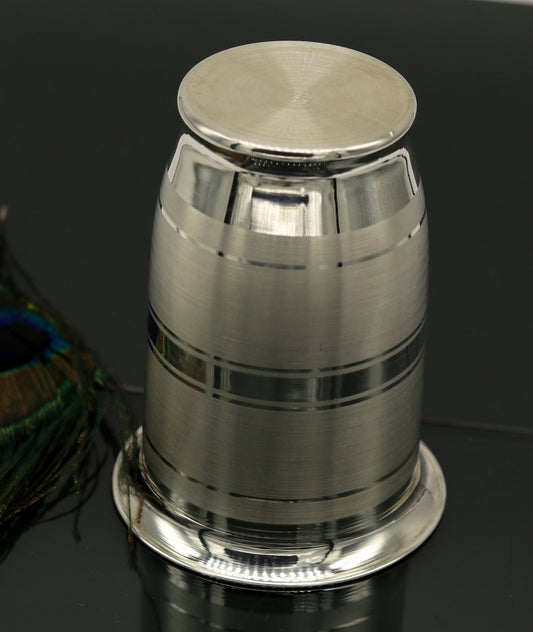 Handmade pure 999 silver water and milk glass tumbler, silver flask, and baby silver utensils by Tribal Ornaments.