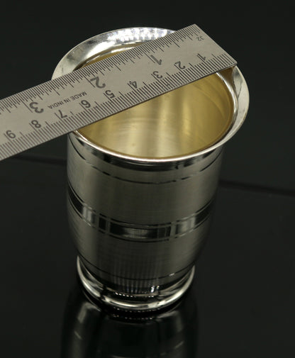 Handmade Pure 999 fine silver water and milk tumbler, silver flask, and kids' silver utensils from TRIBAL ORNAMENTS.
