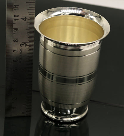 Pure 999 fine silver handmade water and milk tumbler, silver flask, and baby utensils from Tribal Ornaments, traditional silver vessels.