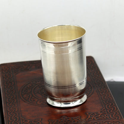 Handmade Pure 999 silver water and milk tumbler, silver flask, and utensils for kids by TRIBAL ORNAMENTS, traditional silver vessels.