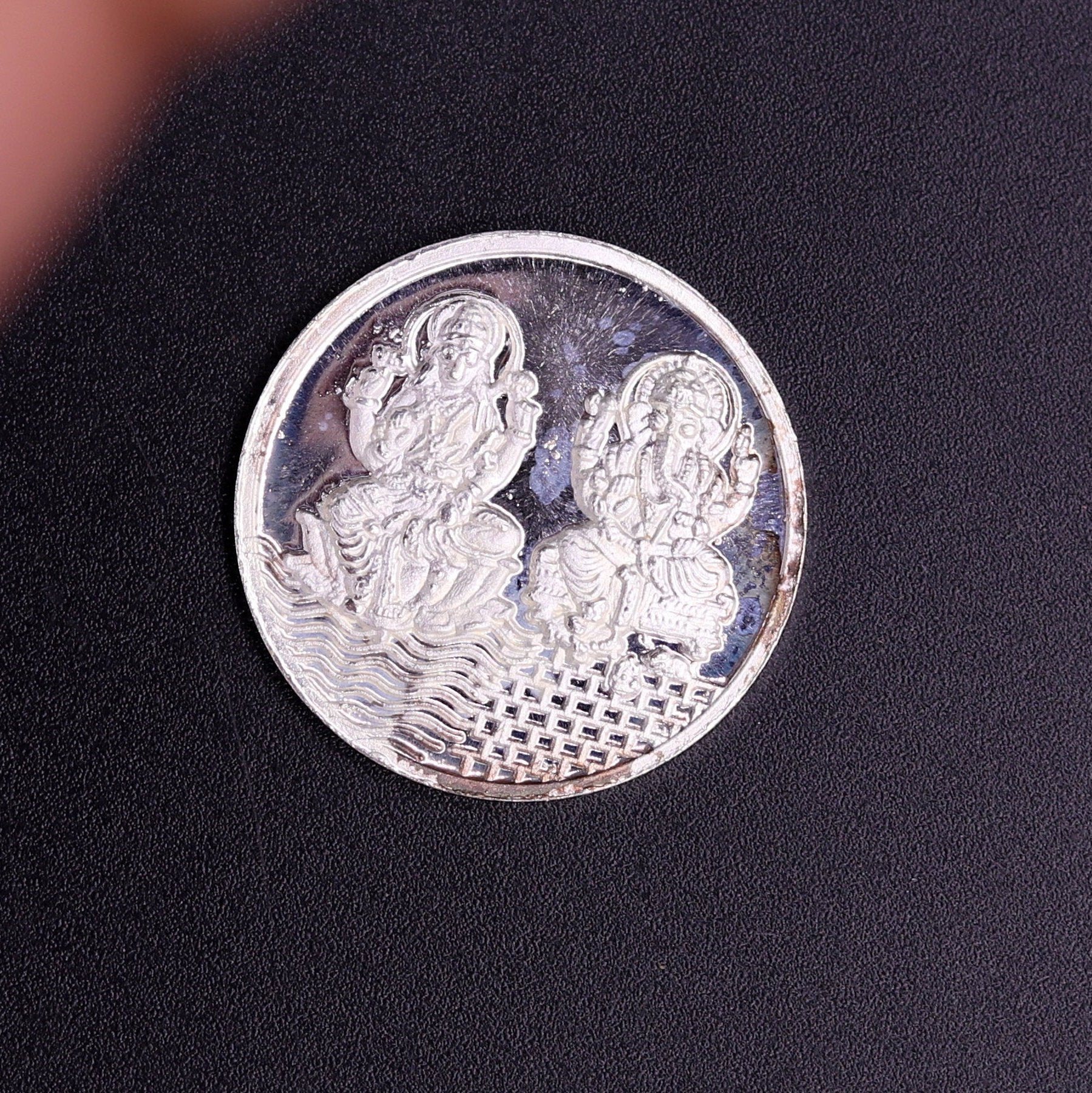 Pure solid 999 silver Indian idol coin featuring Lord Ganesha and Laxmi, 5 grams, collectible coin by TRIBAL ORNAMENTS.