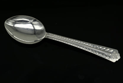 Handmade pure sterling silver 6-inch spoon from Tribal Ornaments, showcasing its polished surface and traditional design for kitchen use.