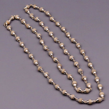 Sterling silver Tulsi Mala necklace with handcrafted basil beads, Ayurvedic spiritual jewelry, featuring a rosary chain for protection and focus.