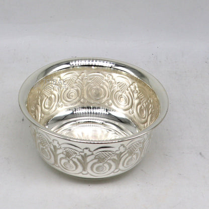 Silver handmade work bowl and utensils for rice ceremony and puja, featuring unique tribal design for worship and prasad.