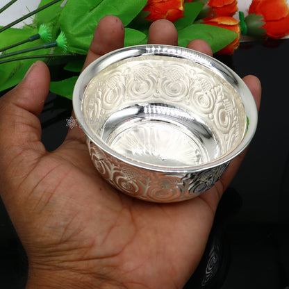 Silver handmade work bowl with intricate design, part of silver utensils set for rice ceremony and puja worship.