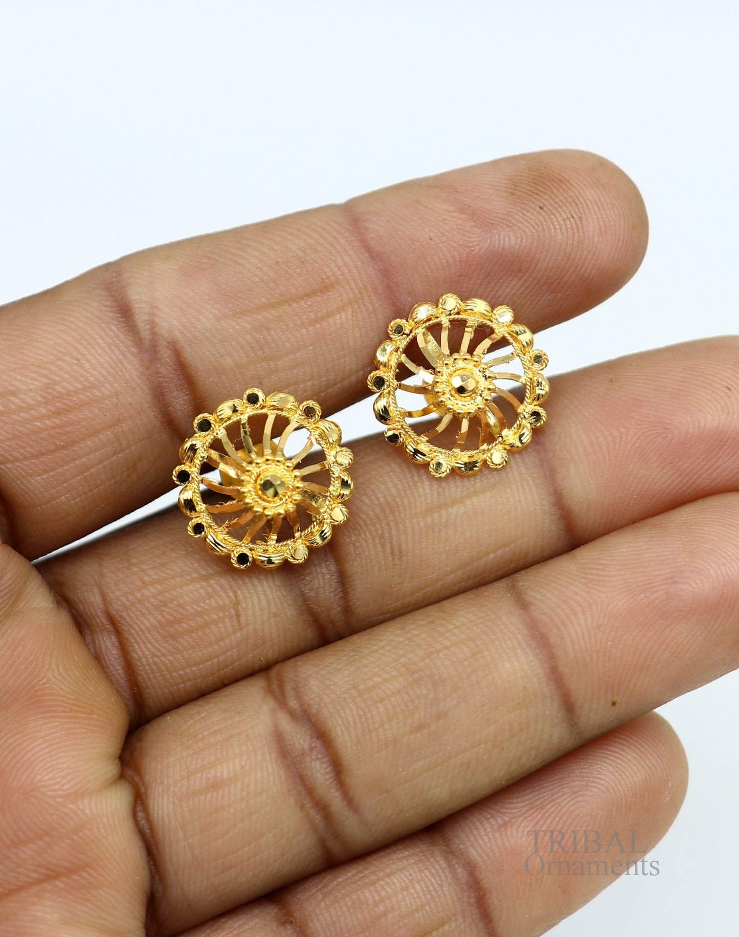 Handmade 22K yellow gold filigree stud earrings by TRIBAL ORNAMENTS, showcasing intricate ethnic jewelry design for bridal or stylish wear.