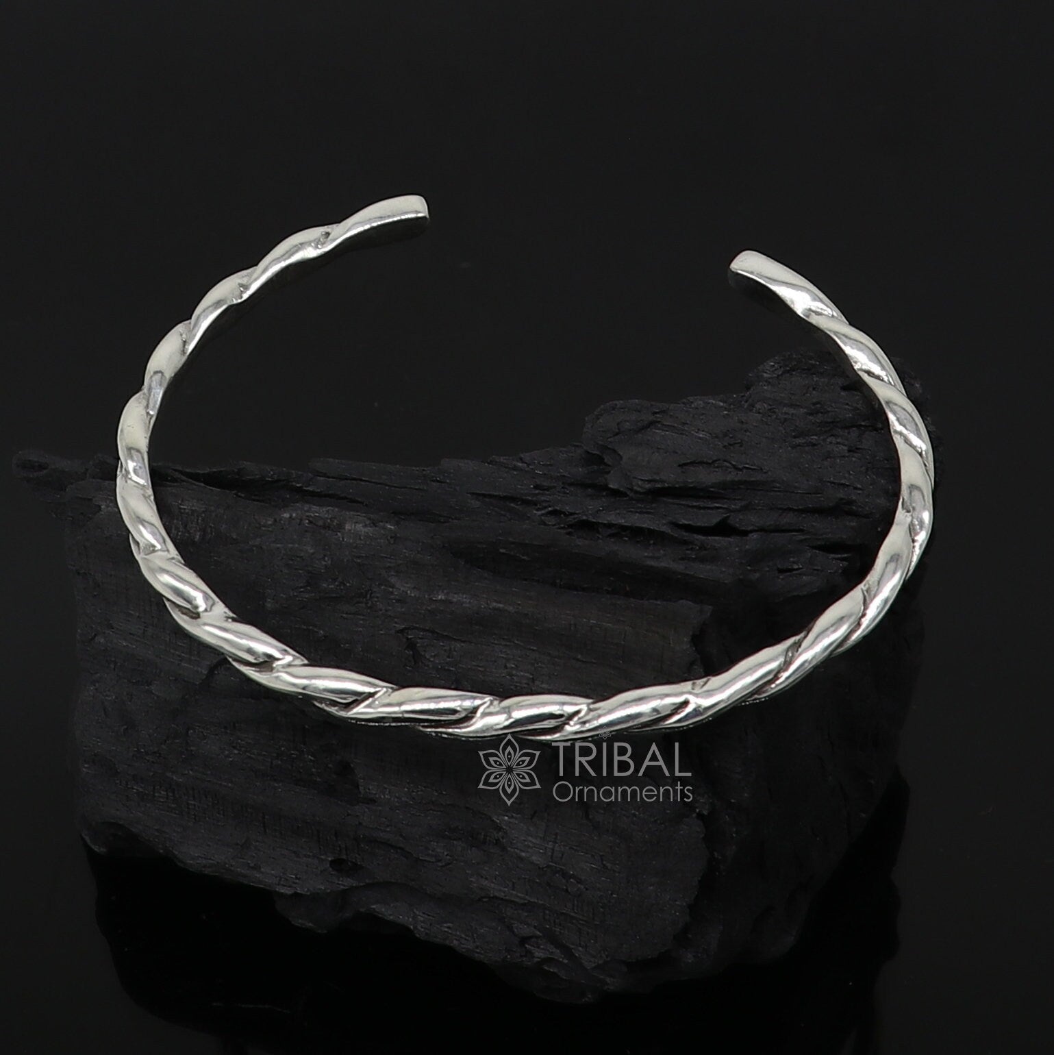 Sterling silver twisting cuff bracelet by Tribal Ornaments, modern unisex bangle with a 4mm solid design, stylish and trendy accessory.