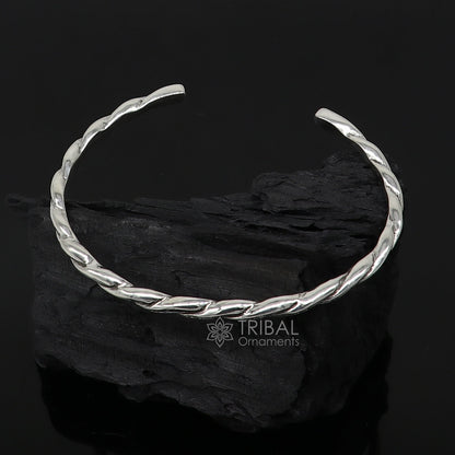 Sterling silver twisting cuff bracelet by Tribal Ornaments, modern unisex bangle with a 4mm solid design, stylish and trendy accessory.