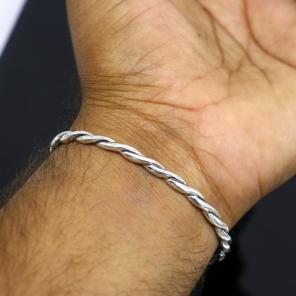 Sterling silver twisting cuff bracelet by Tribal Ornaments, modern unisex bangle with 4mm solid silver design, stylish and trendy.