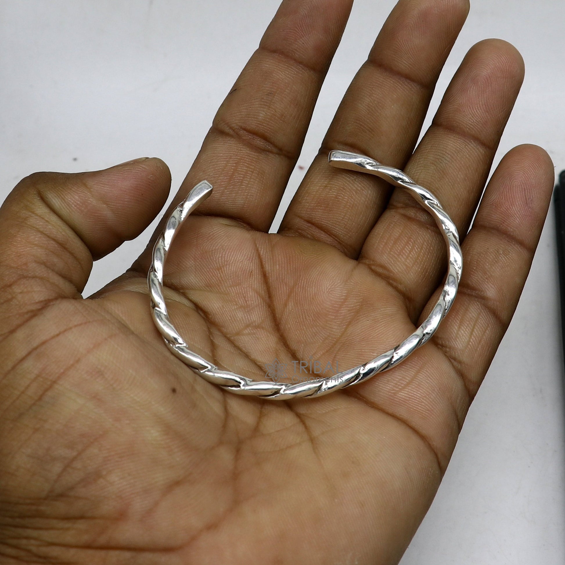 Solid 4mm 925 sterling silver twisting cuff bracelet by Tribal Ornaments, modern unisex bangle with trendy design.