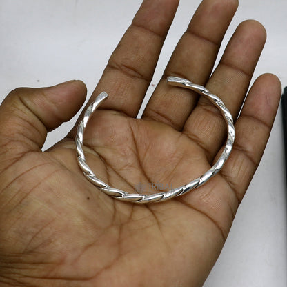 Solid 4mm 925 sterling silver twisting cuff bracelet by Tribal Ornaments, modern unisex bangle with trendy design.