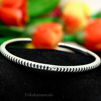 Unisex 925 sterling silver adjustable cuff bracelet by Tribal Ornaments, featuring a sleek solid design with handcrafted Indian style.
