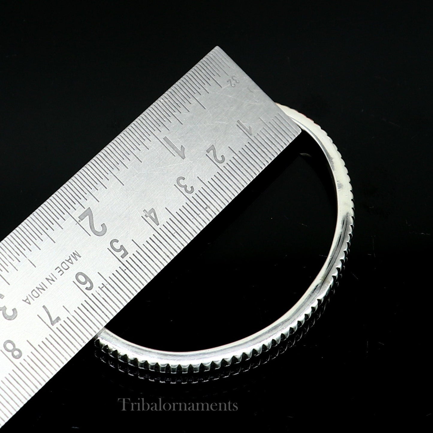 Sterling silver adjustable cuff bangle bracelet by TRIBAL ORNAMENTS, handmade unisex jewelry with a solid silver finish.