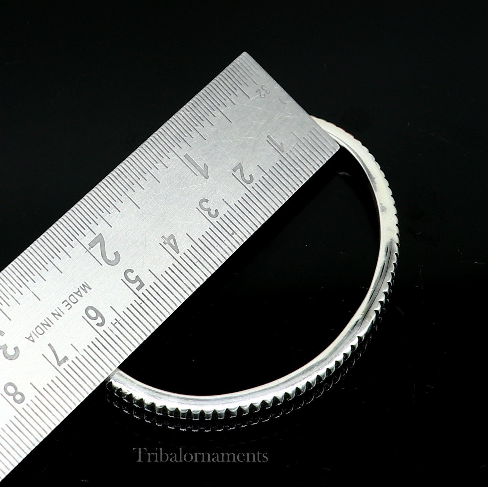 Sterling silver adjustable cuff bangle bracelet by TRIBAL ORNAMENTS, handmade unisex jewelry with a solid silver finish.