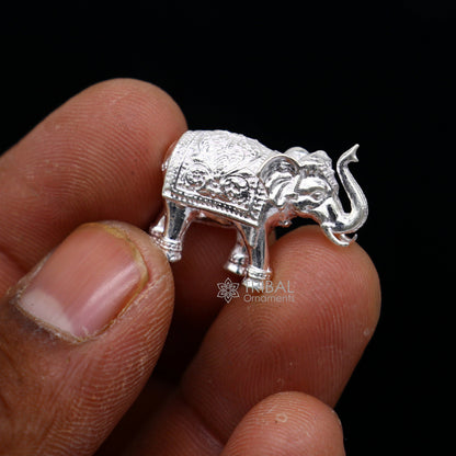 Solid 925 sterling silver handmade elephant figurine, upper trunk design, ideal for puja, wealth, and prosperity decoration.