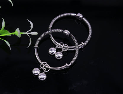 Sterling silver baby adjustable bangles bracelet with designer charm, handmade and stylish jewelry for kids by TRIBAL ORNAMENTS.