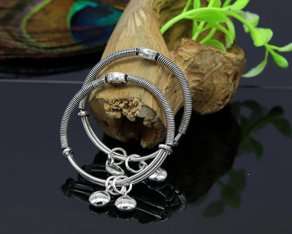 Sterling silver baby adjustable bangle bracelet by TRIBAL ORNAMENTS, stylish designer charm jewelry for kids.