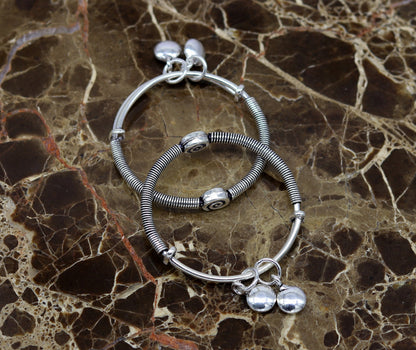 Sterling silver baby bangle bracelet by TRIBAL ORNAMENTS, stylish adjustable design with charming details for kids.