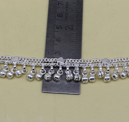 Solid pure silver baby anklet with noisy jingle bells, handmade flexible chain for newborns, from Tribal Ornaments.