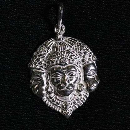 Solid silver Lord Hanuman pendant featuring three faces, handmade Indian jewelry with intricate tribal design from Rajasthan.