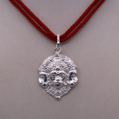 Solid silver Lord Hanuman pendant with three faces, handmade tribal jewelry from Rajasthan featuring intricate Indian god idol design.
