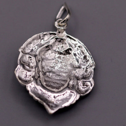 Solid silver Lord Hanuman pendant featuring three faces, handmade tribal jewelry from Rajasthan, showcasing intricate Indian god design.