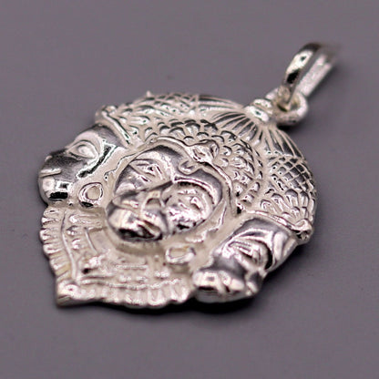 Solid silver Lord Hanuman pendant featuring three faces, handcrafted tribal jewelry from Rajasthan, India.