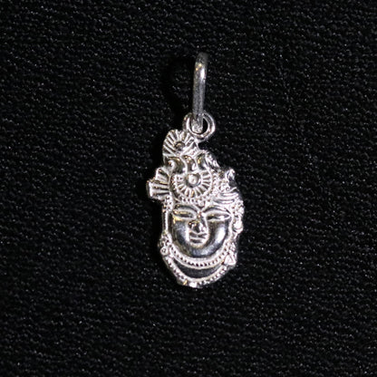 Solid silver Shreenathji pendant from Tribal Ornaments, handcrafted Indian Vishnu idol jewelry, unisex religious pendant.
