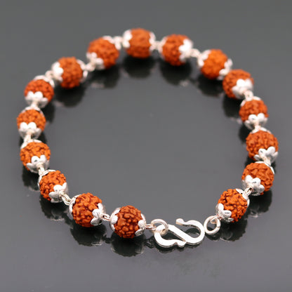 Handmade solid silver bracelet with natural Rudraksha beads, 8.5 inches long, from Rajasthan, India by TRIBAL ORNAMENTS.