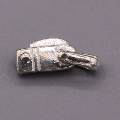 Solid silver small knife pendant by TRIBAL ORNAMENTS, handcrafted jewelry for protection from negative energy, with intricate tribal design.