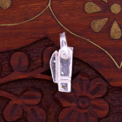 Solid silver small knife pendant by TRIBAL ORNAMENTS, handmade jewelry for protection against negative energy, featuring traditional design.