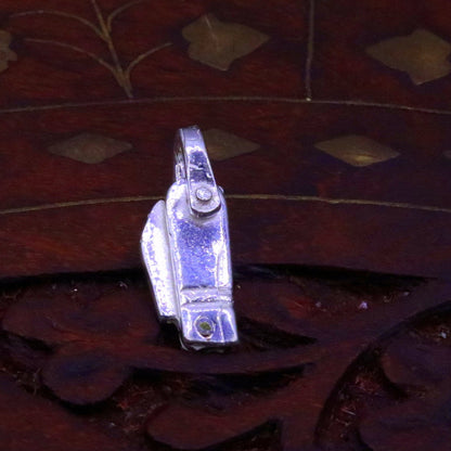 Small solid silver knife pendant by TRIBAL ORNAMENTS, handmade jewelry for protection against negative energy, featuring traditional design.