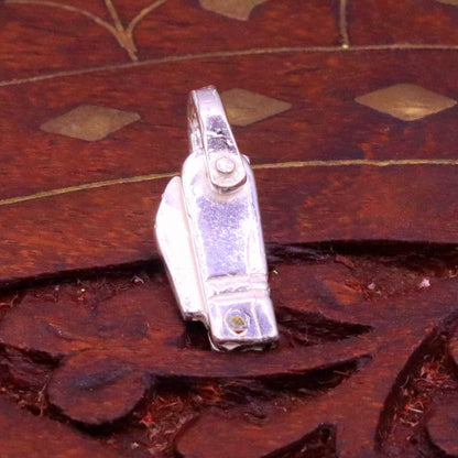 Solid silver small knife pendant by TRIBAL ORNAMENTS, handmade jewelry for protection against negative energy, featuring traditional design.