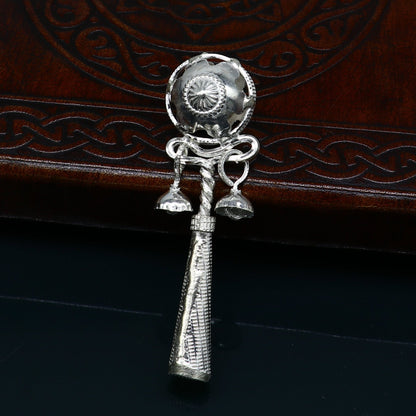 Handmade solid sterling silver baby Krishna gifting bell toy with intricate design, featuring a silver whistle and temple-inspired details.