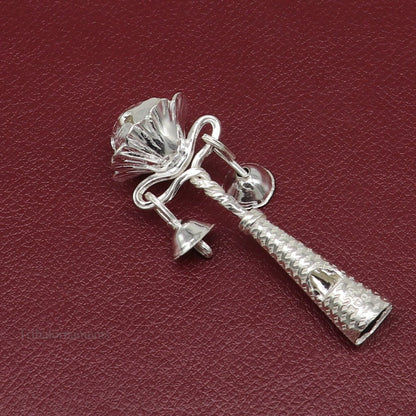 Sterling silver handmade baby Krishna gifting bell toy with intricate tribal design, suitable as a newborn gift or silver temple article.