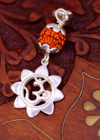 Solid sterling silver Aum pendant with natural rudraksha bead, unisex handmade jewelry, tribal ornaments, stylish and modern design.