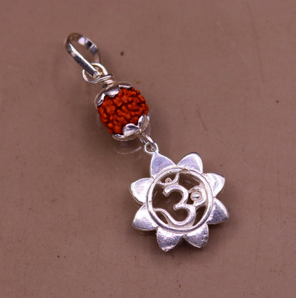 Sterling silver Aum pendant with natural Rudraksha bead, unisex handmade jewelry by TRIBAL ORNAMENTS.