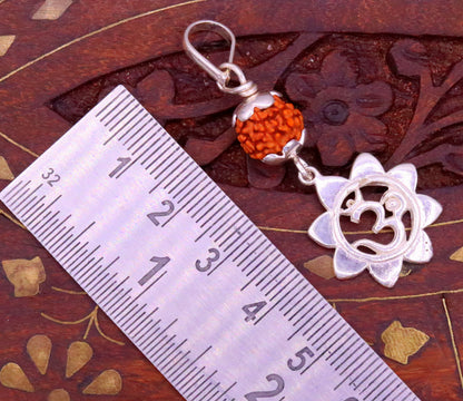 Sterling silver Aum pendant with natural rudraksha bead, unisex tribal jewelry, handmade and stylish for modern jewelry wear.