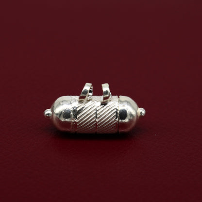 Solid sterling silver round amulet box pendant with tribal design, featuring engraved mantra and kavacham motifs.